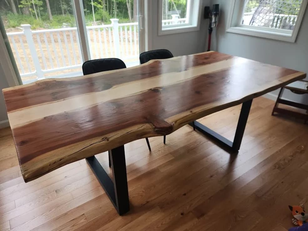 Handcrafted dining table with live edge slab